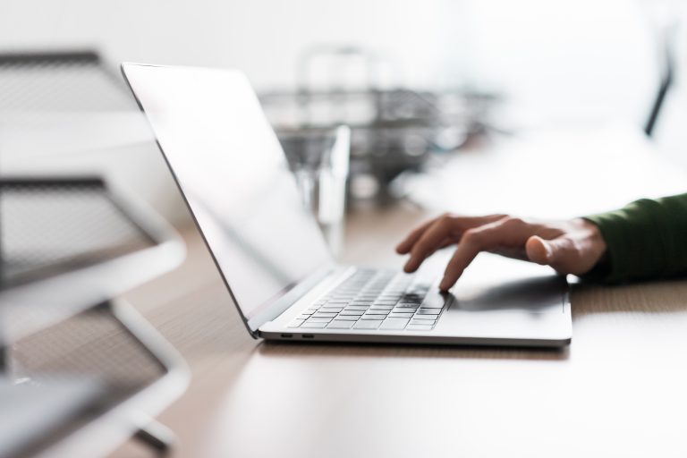 man-using-his-laptop-in-the-office.jpg